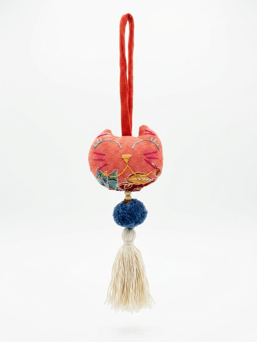 Big head cat with tassel